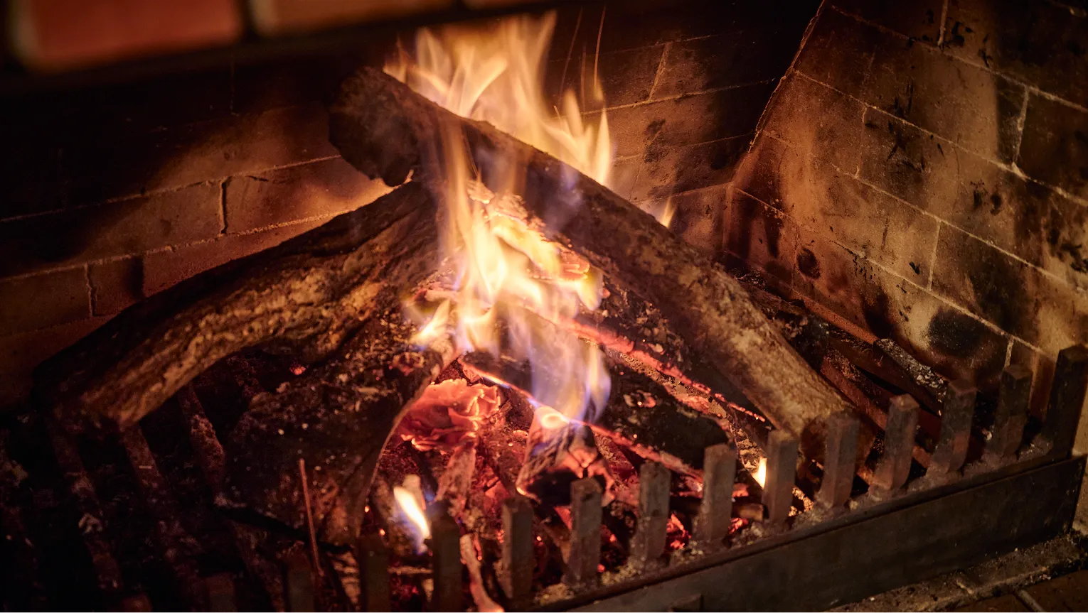 Logs burning inside the fireplace