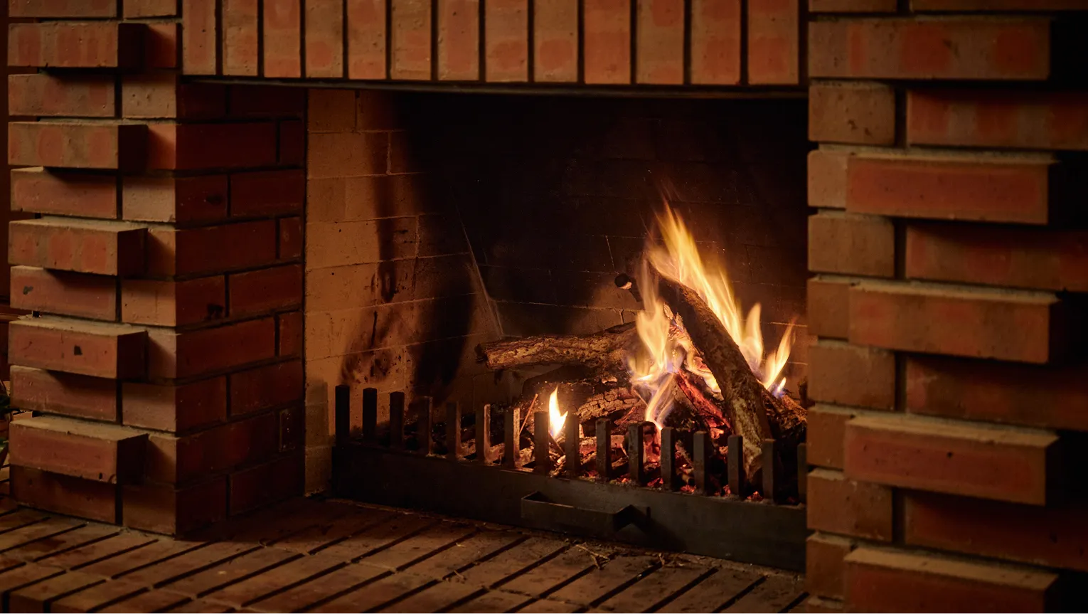 Fire burning in the brick fireplace