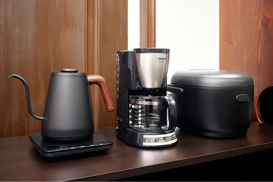 Electric kettle, coffee maker, and rice cooker on the counter