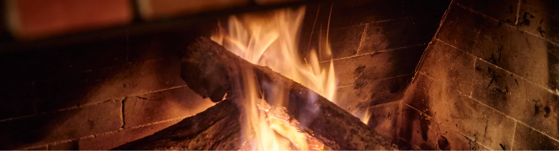 Fire burning low in the brick fireplace