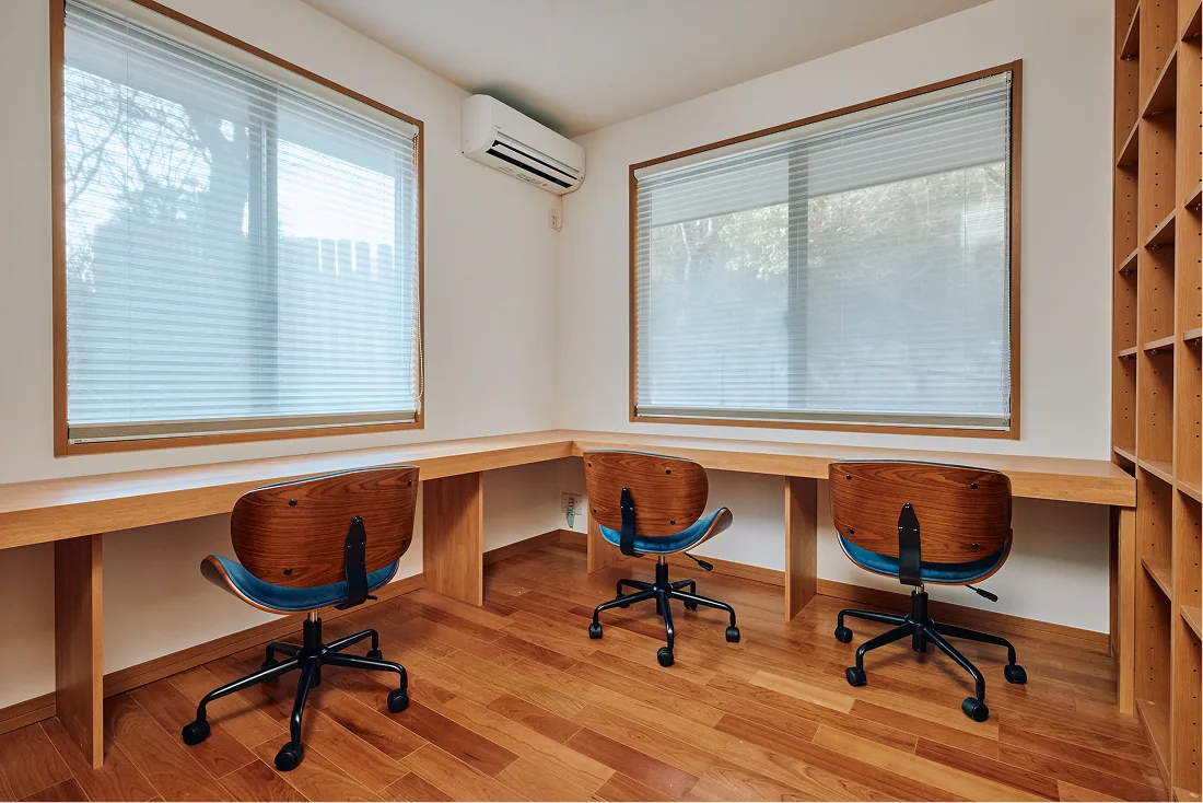 Workspace with three desk chairs
