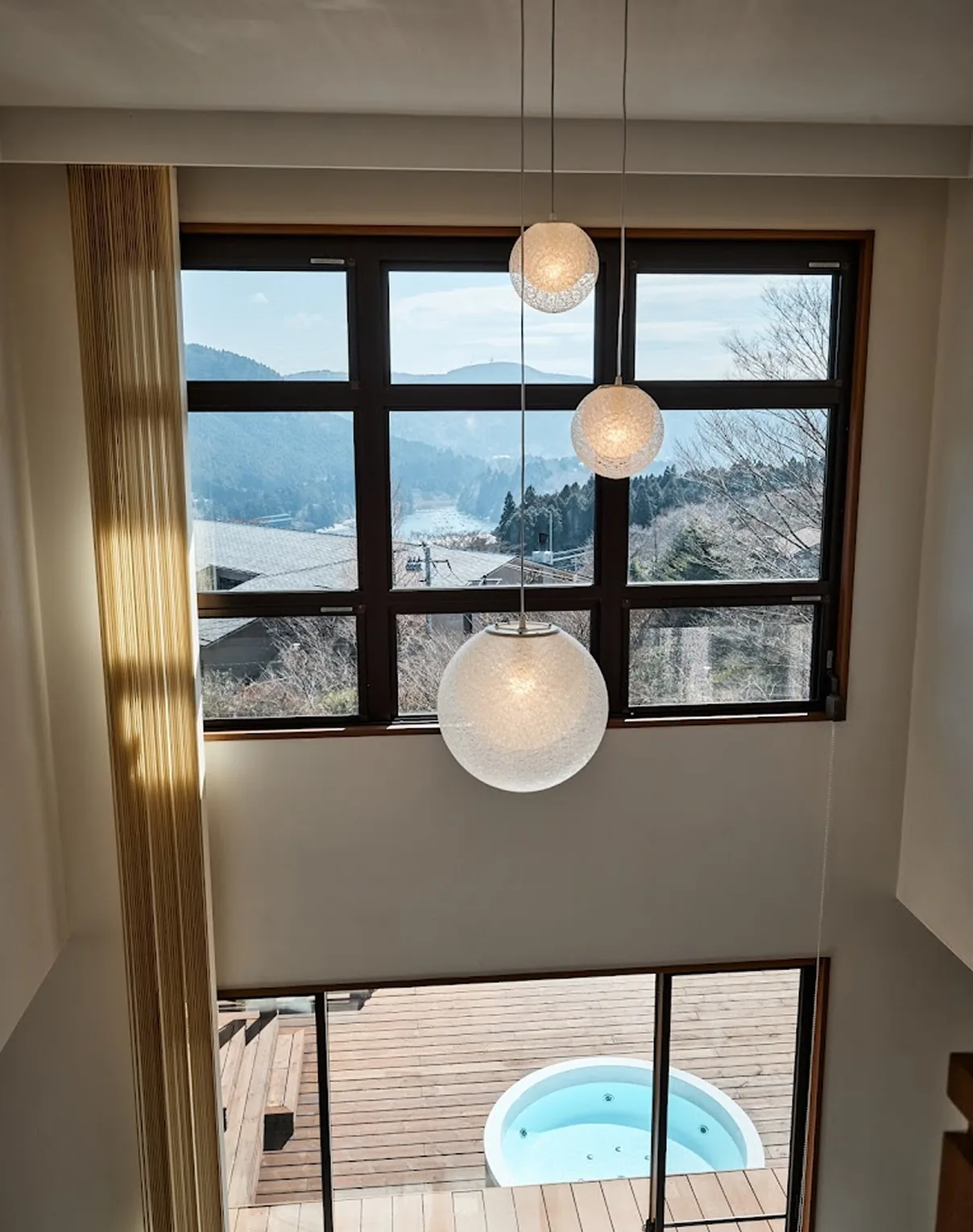 Looking up through the double-height windows and skylight toward Lake Ashi