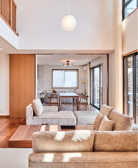 Sunlit double-height living and dining area