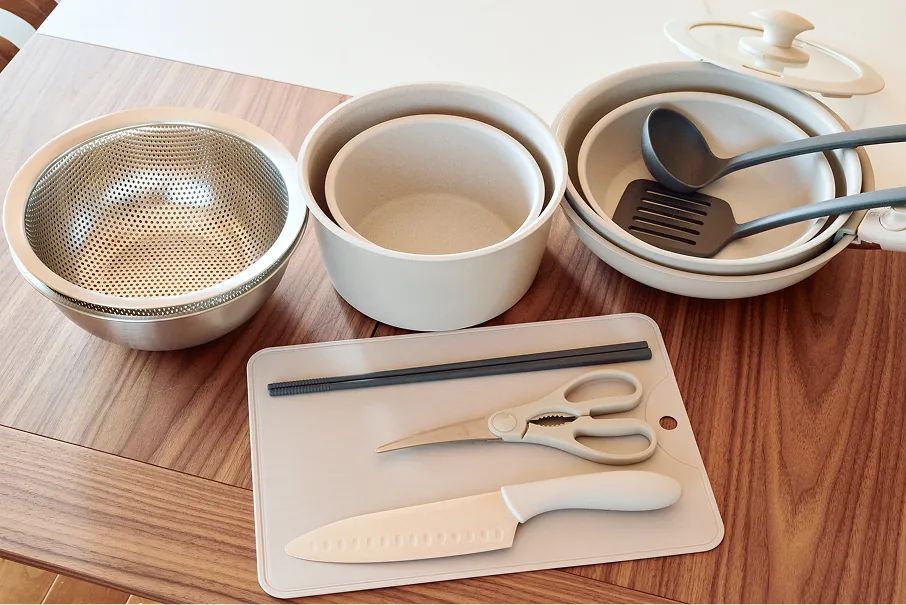 Pots, pans, cutting board, knives, and other cooking utensils