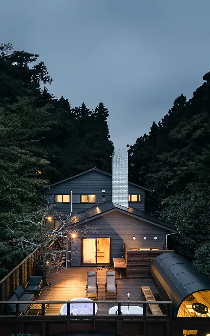 The villa lit up at night